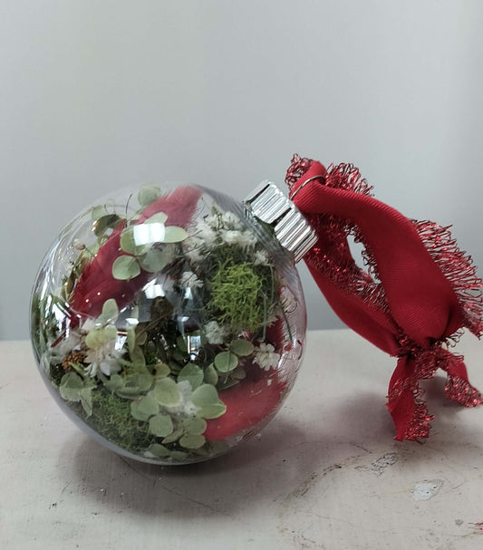 Ornament filled with dried florals, perfect for gifts and home decor. Ideal for local florists and flower arrangements.