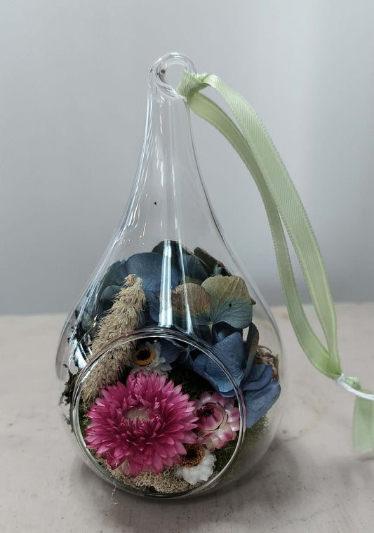 Terrarium Ornament featuring a teardrop glass filled with dried flowers and botanicals, perfect for floral decor.